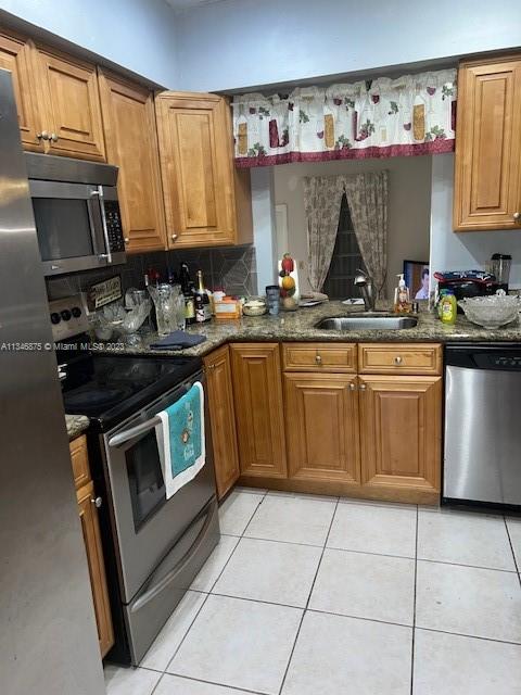 Kendall Green Pompano Beach, FL 33060 - Photo 15 of 24 a kitchen with a sink stove and cabinets