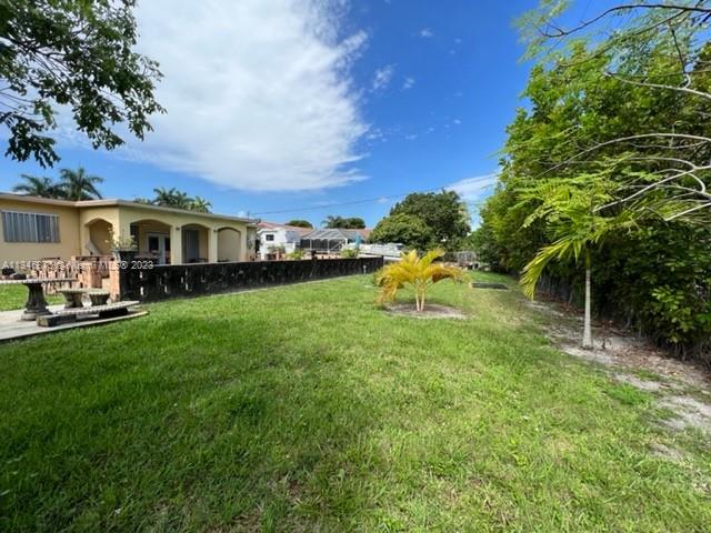 Kendall Green Pompano Beach, FL 33060 - Photo 19 of 24 a view of a house with a backyard porch and sitting area