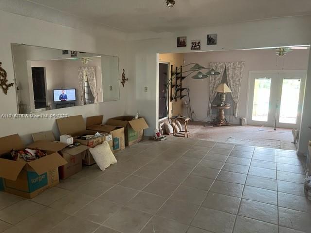 Kendall Green Pompano Beach, FL 33060 - Photo 2 of 24 a living room with patio furniture and a large window