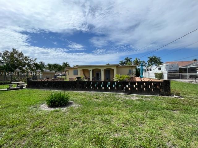 Kendall Green Pompano Beach, FL 33060 - Photo 21 of 24 a view of a yard and front view of a house