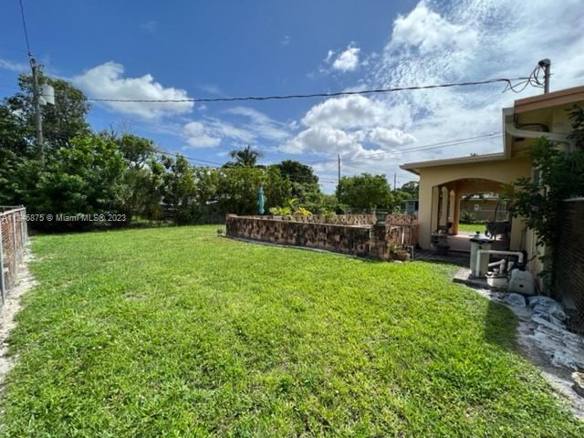 Kendall Green Pompano Beach, FL 33060 - Photo 22 of 24 a view of yard with swimming pool and green space