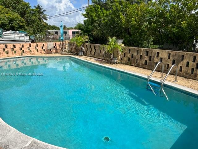 Kendall Green Pompano Beach, FL 33060 - Photo 23 of 24 a view of a chairs and table in the patio