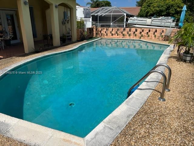 Kendall Green Pompano Beach, FL 33060 - Photo 24 of 24 a view of swimming pool with a yard