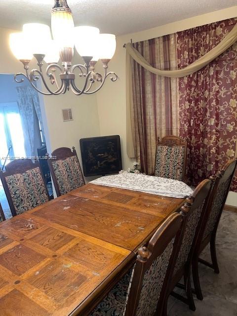 Kendall Green Pompano Beach, FL 33060 - Photo 10 of 24 a bedroom with a bed and a table in it