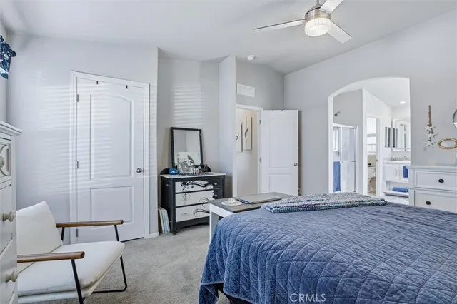 a bedroom with a bed and a table in it