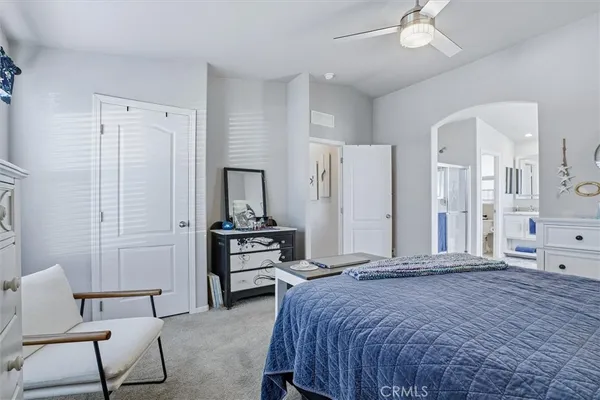 a bedroom with a bed and a table in it