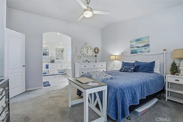 a large bathroom with a large tub shower and windows