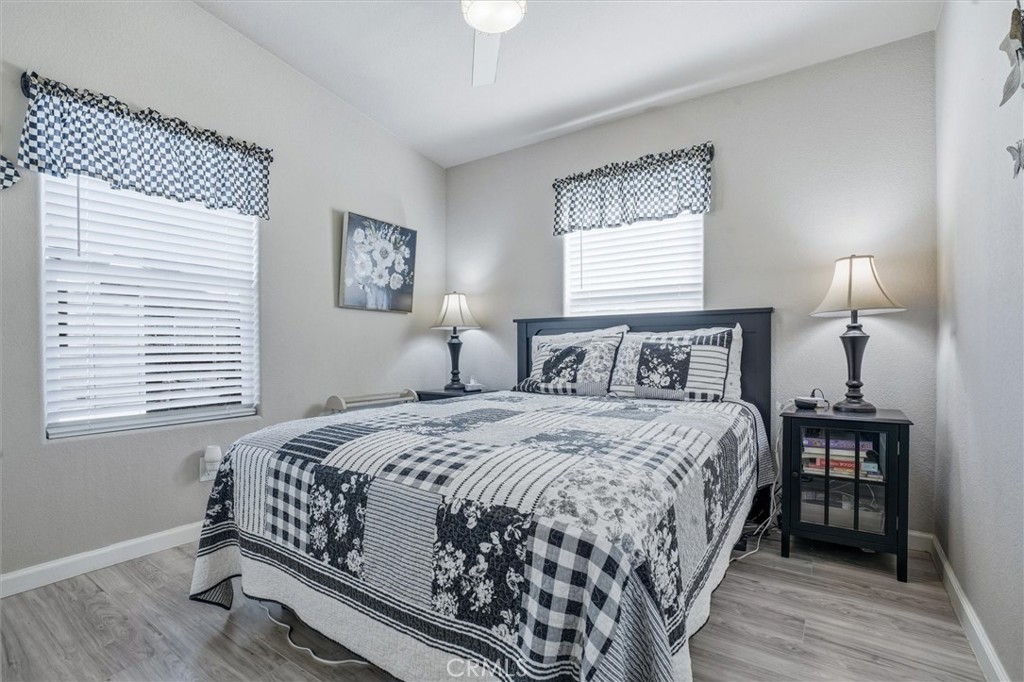 500 Atascadero Road Morro Bay, CA 93442 - Photo 22 of 36 a bedroom with a bed a dresser and a window