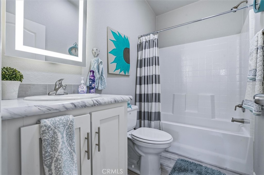 500 Atascadero Road Morro Bay, CA 93442 - Photo 27 of 36 a bathroom with a granite countertop sink a toilet and shower