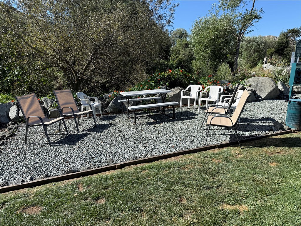 500 Atascadero Road Morro Bay, CA 93442 - Photo 38 of 41 a view of a chairs and table in a backyard