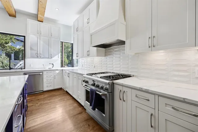 a view of a chairs and table in the balcony
