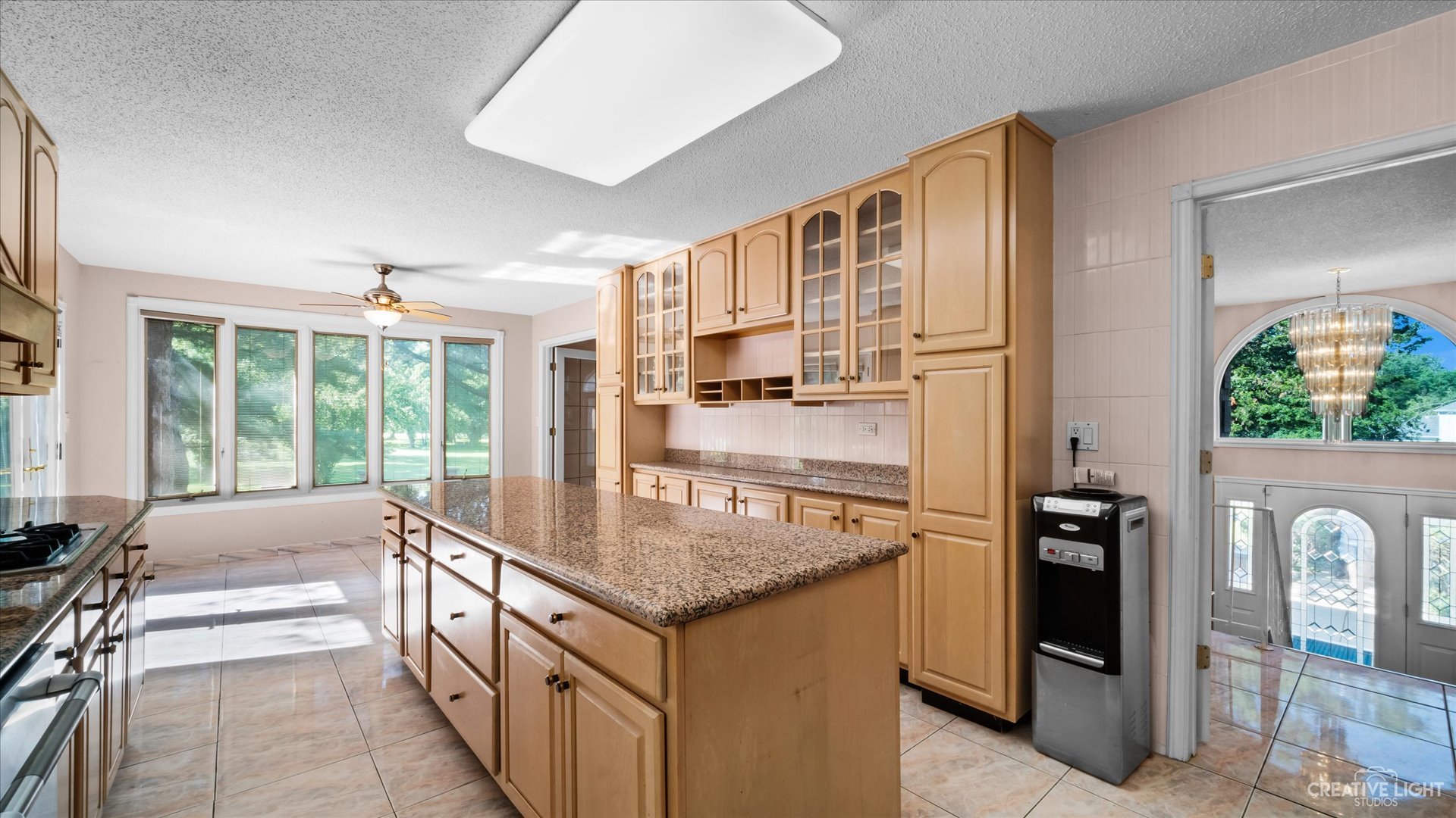 30W400 Army Trail Road Wayne, IL 60184 - Photo 11 of 30 a kitchen with stainless steel appliances granite countertop a refrigerator and a sink