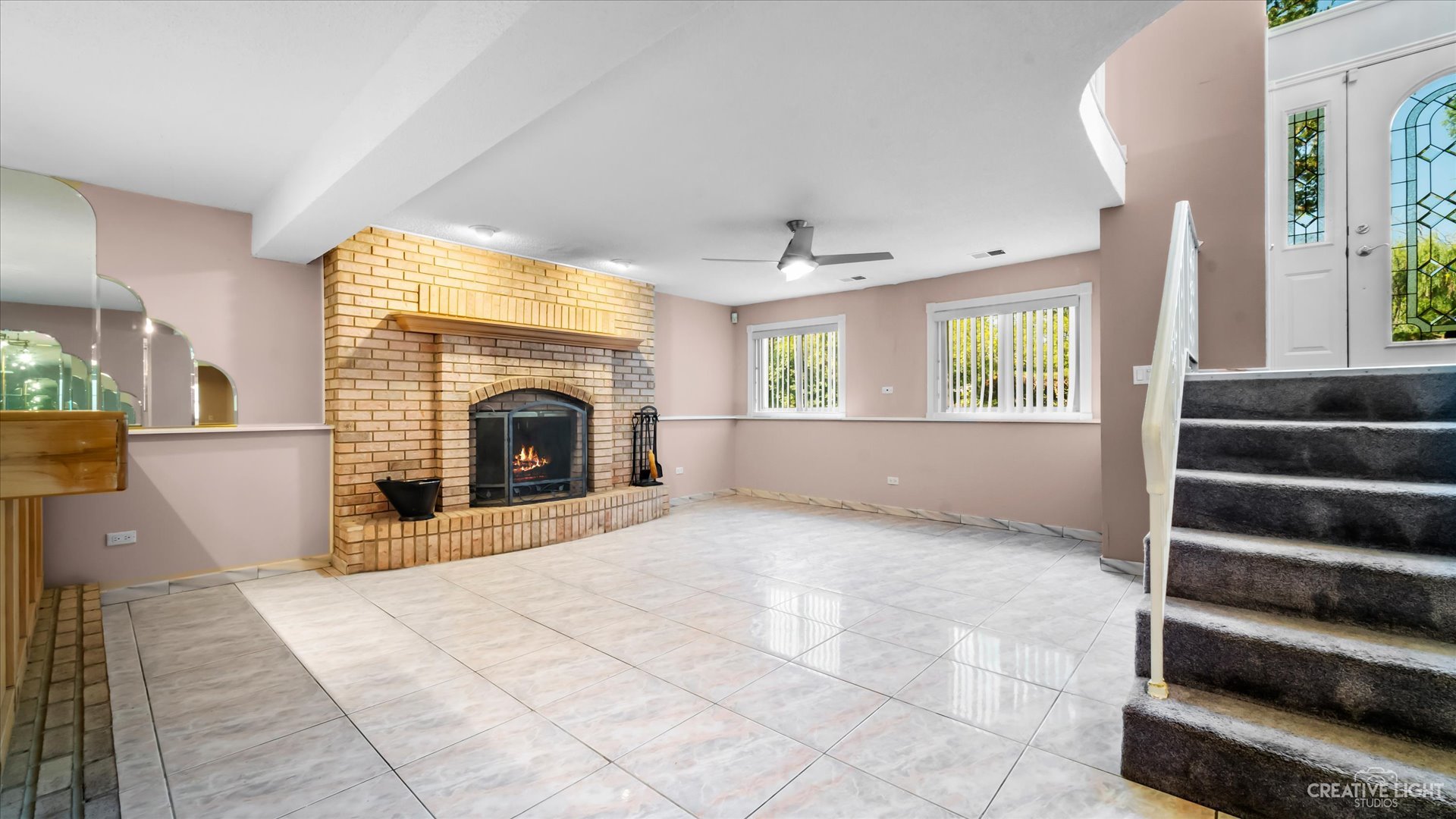 30W400 Army Trail Road Wayne, IL 60184 - Photo 13 of 30 a view of an empty room with a fireplace and a window