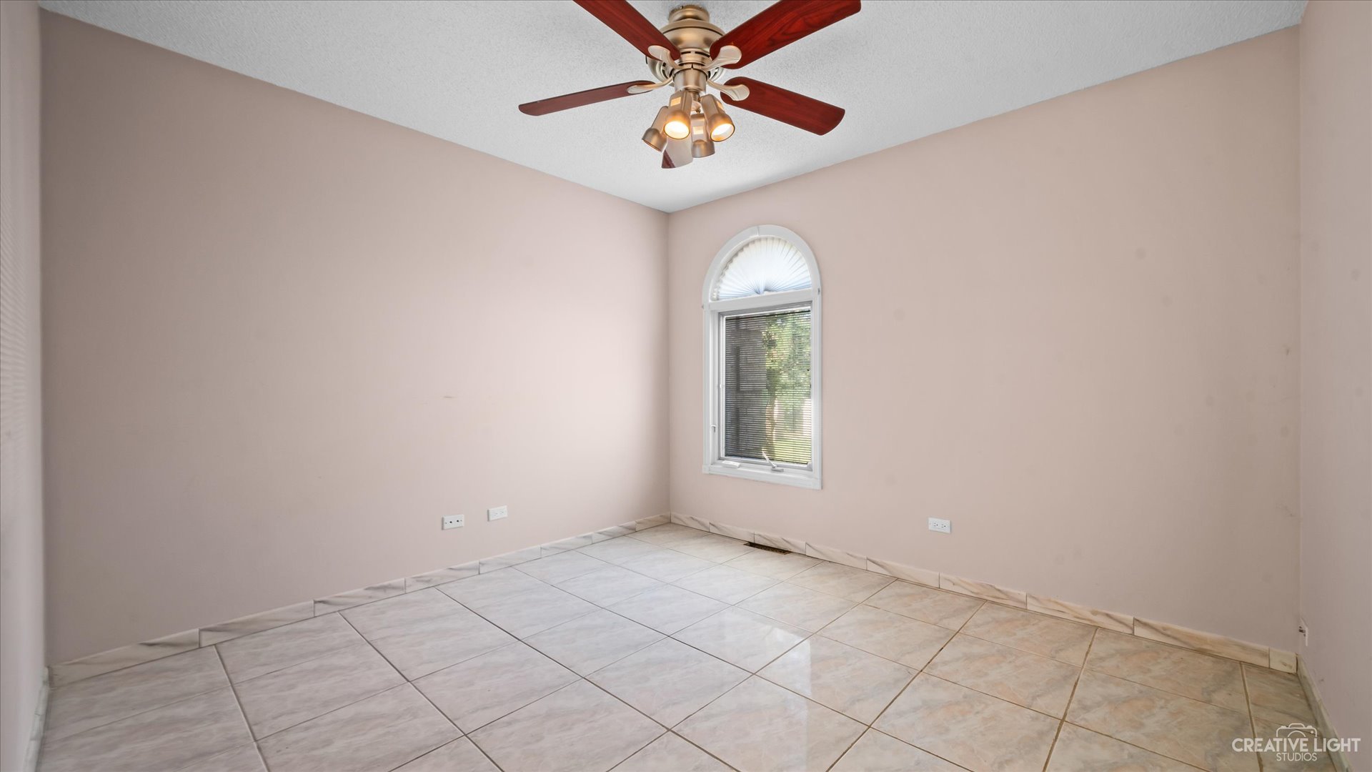 30W400 Army Trail Road Wayne, IL 60184 - Photo 22 of 30 an empty room with a window and a fan