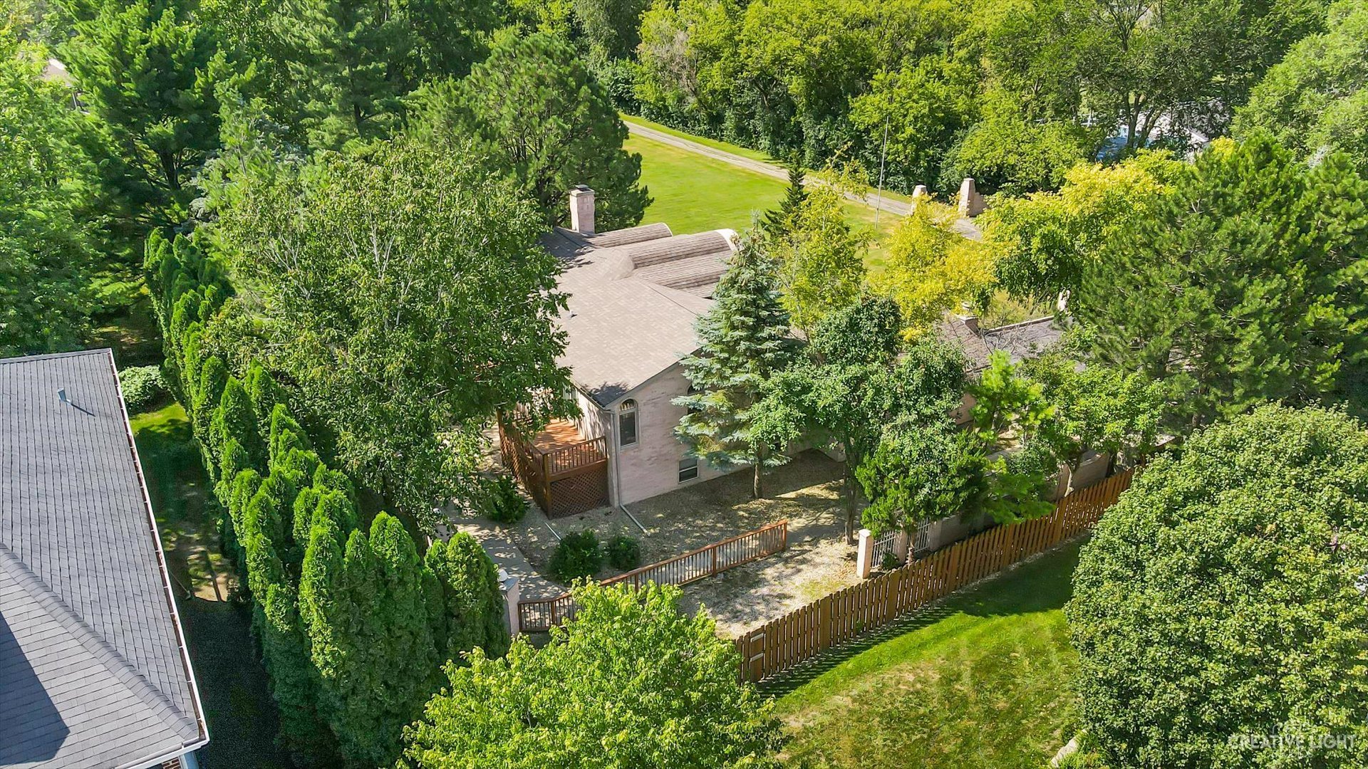 30W400 Army Trail Road Wayne, IL 60184 - Photo 27 of 30 a view of a garden with plants and a fountain