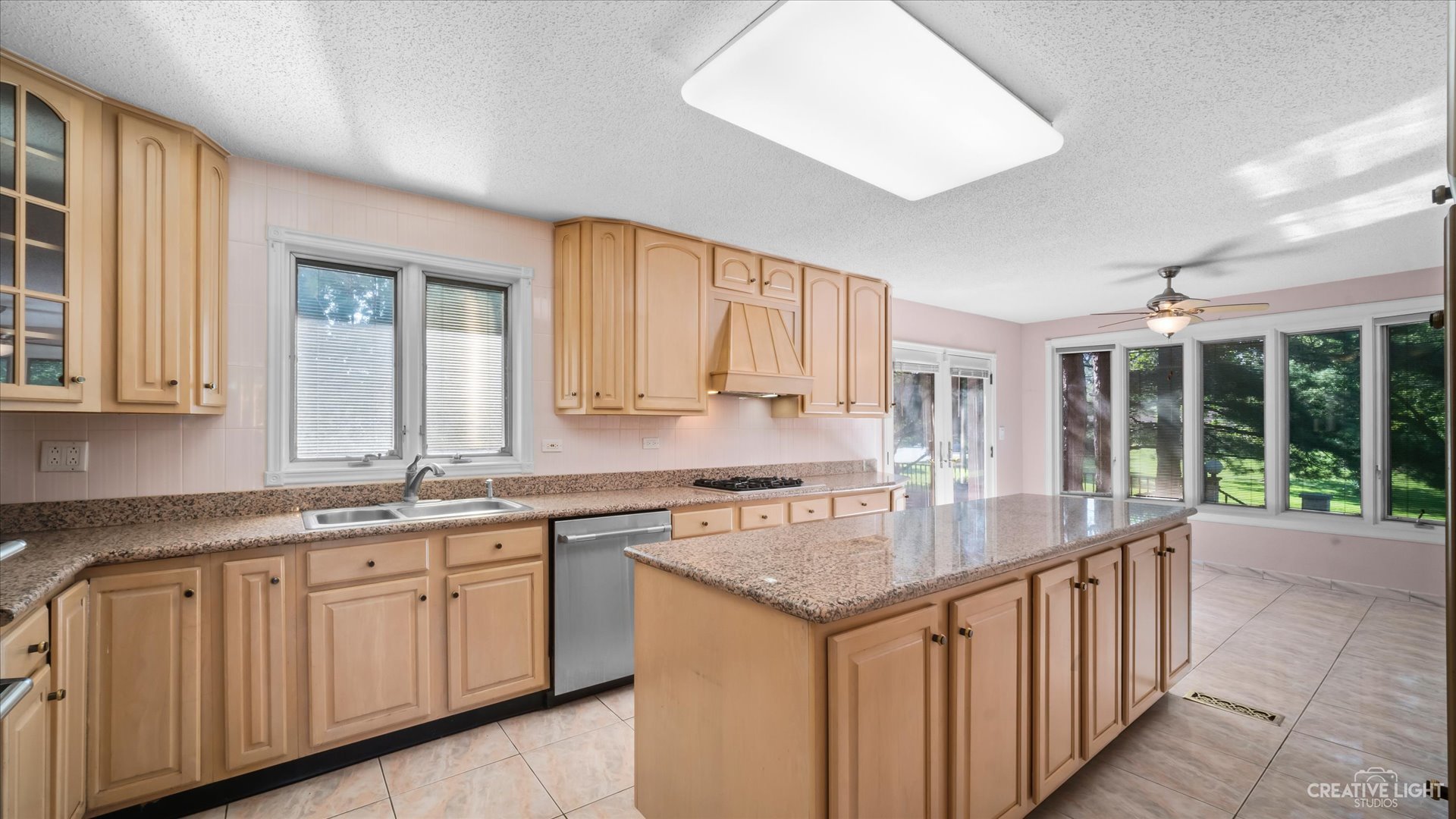 30W400 Army Trail Road Wayne, IL 60184 - Photo 10 of 30 a kitchen with a sink stove and cabinets
