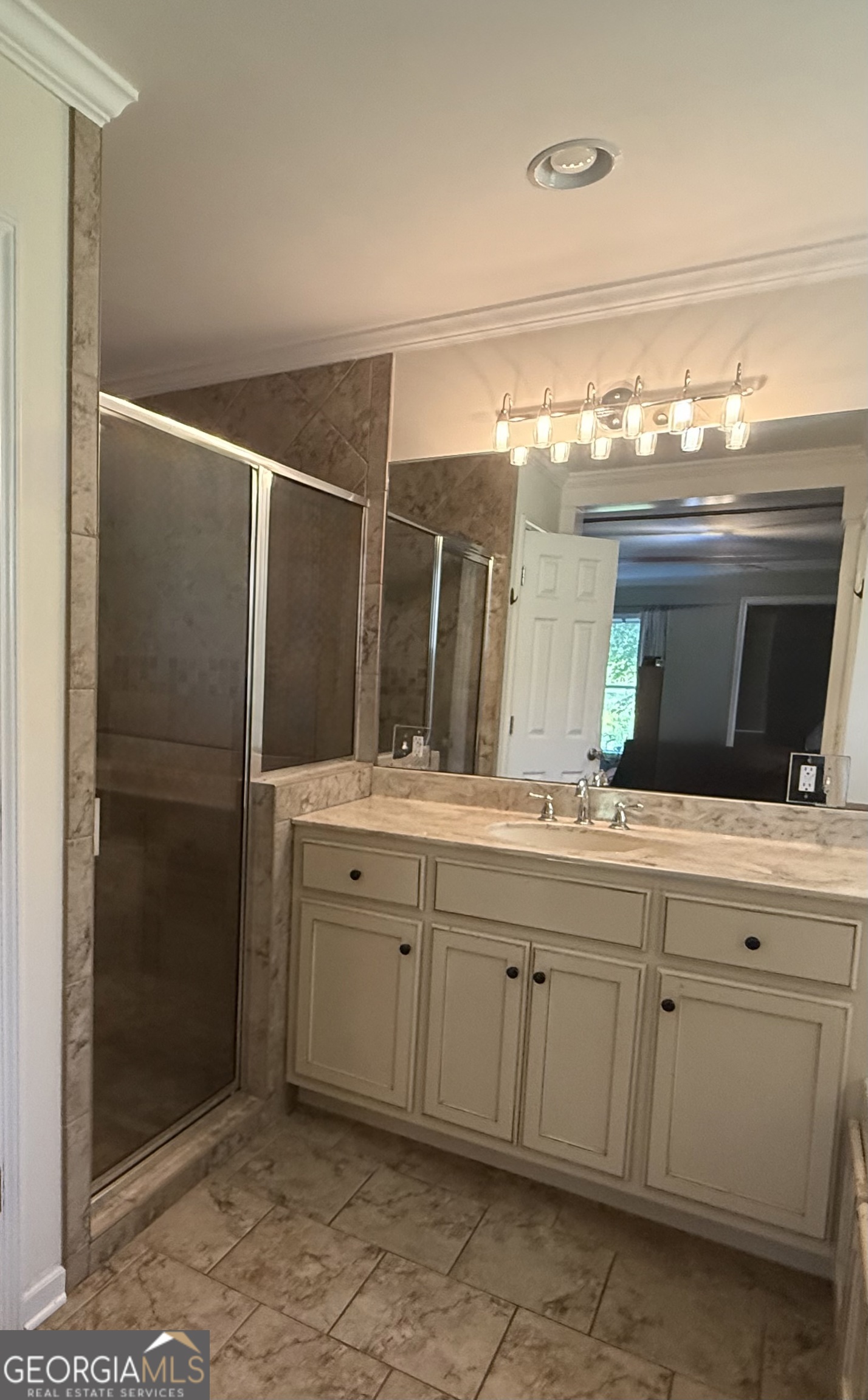 1191 Aderhold Rogers Road Commerce, GA 30530 - Photo 12 of 30 a bathroom with a double vanity sink and mirror