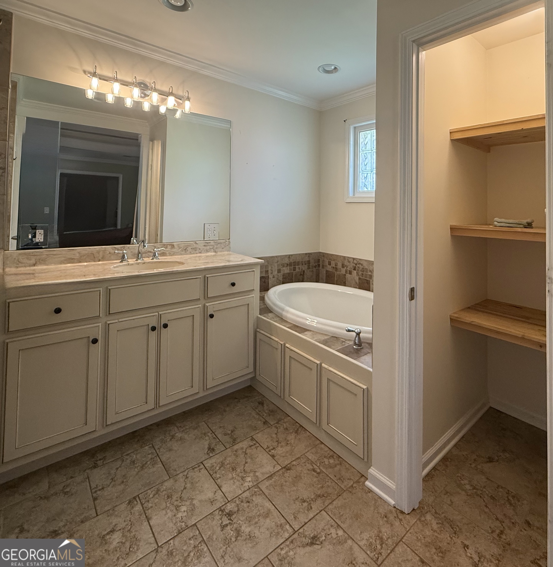 1191 Aderhold Rogers Road Commerce, GA 30530 - Photo 13 of 30 a kitchen with a sink stove and cabinets