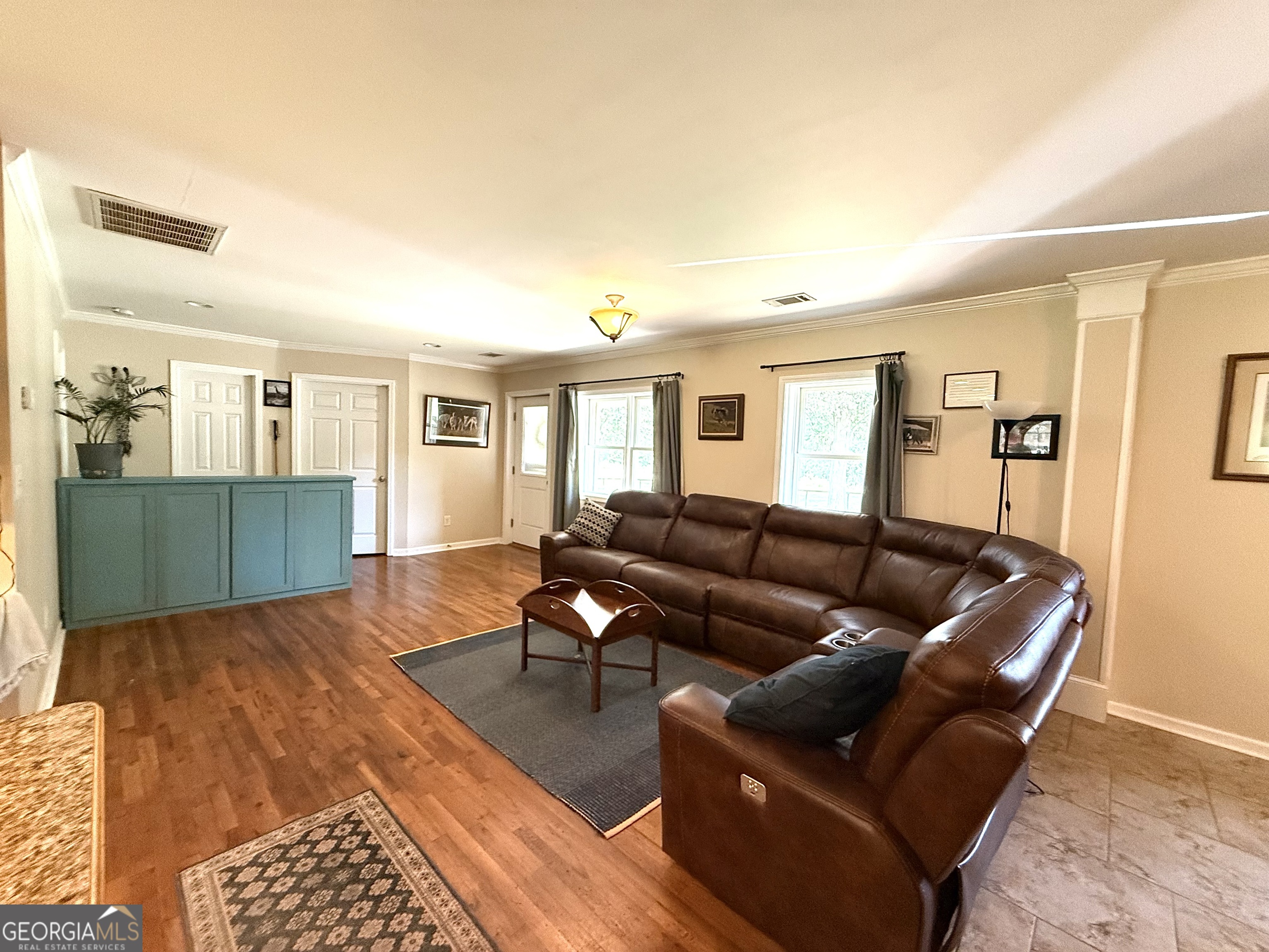 1191 Aderhold Rogers Road Commerce, GA 30530 - Photo 17 of 33 a living room with furniture and wooden floor