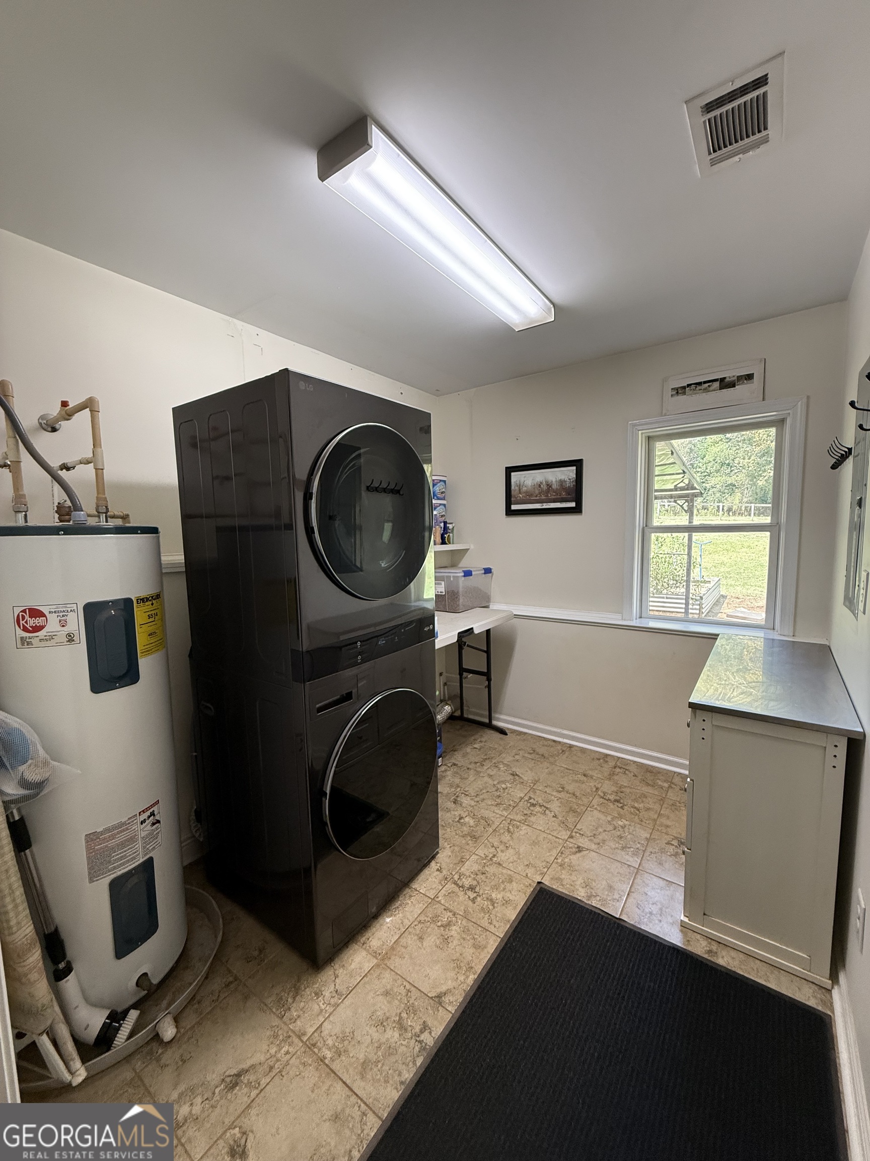 1191 Aderhold Rogers Road Commerce, GA 30530 - Photo 27 of 33 a view of a kitchen with a sink washer and dryer