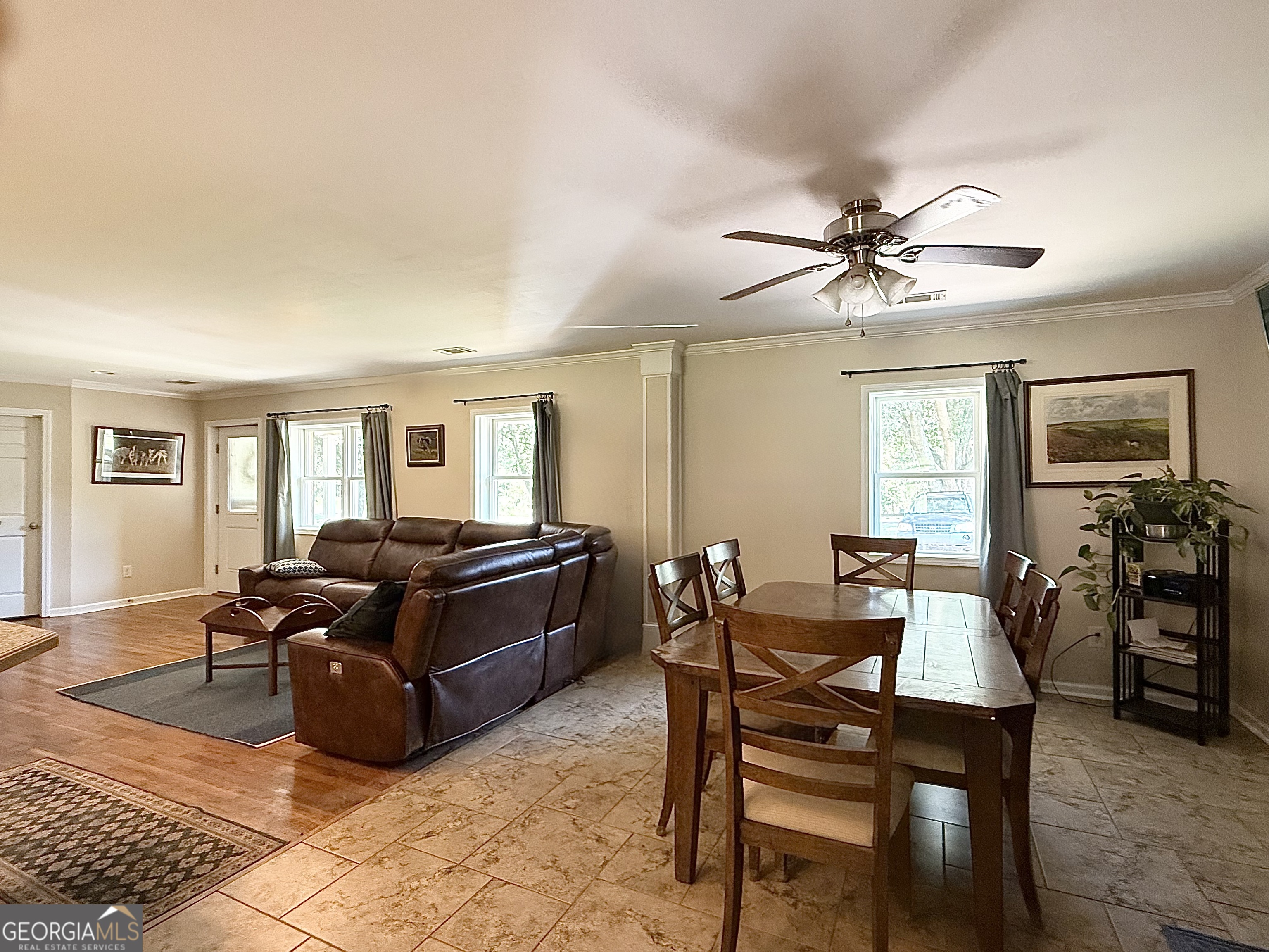1191 Aderhold Rogers Road Commerce, GA 30530 - Photo 5 of 30 a living room with furniture dining table and a window