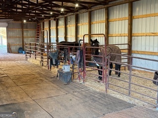 1191 Aderhold Rogers Road Commerce, GA 30530 - Photo 7 of 33 an outdoor space with lots of chairs and a large window