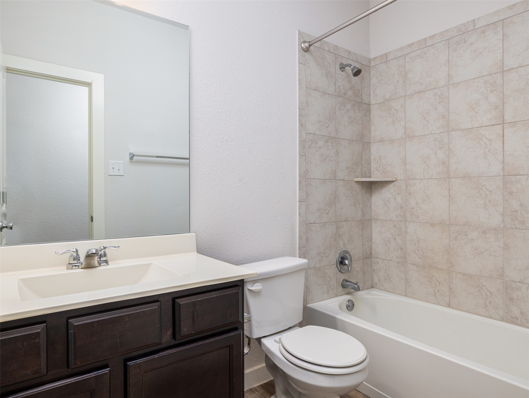 6856 Catania Loop Round Rock, TX 78665 - Photo 20 of 30 Full bathroom with shower / bath combination, vanity, and a textured wall