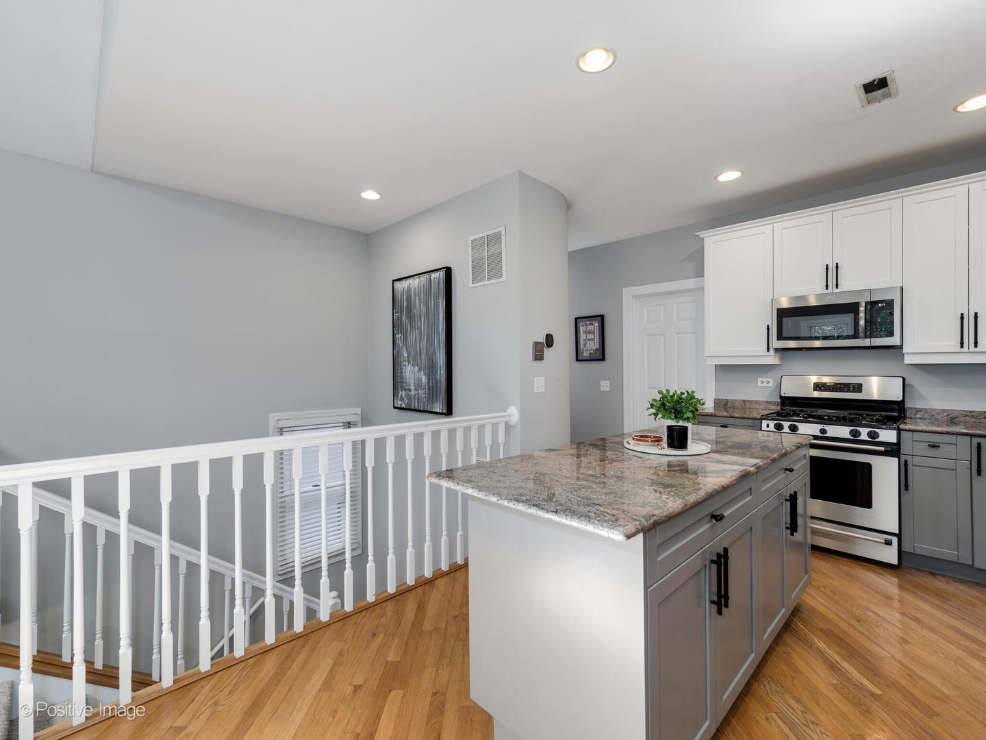 2938 North Damen Avenue, Unit 3 Chicago, IL 60618 - Photo 11 of 22 a kitchen that has a lot of stainless steel appliances