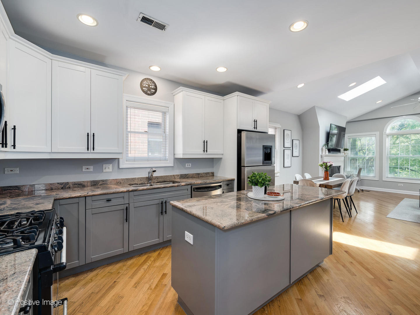 2938 North Damen Avenue, Unit 3 Chicago, IL 60618 - Photo 12 of 22 a kitchen with sink stove and cabinets