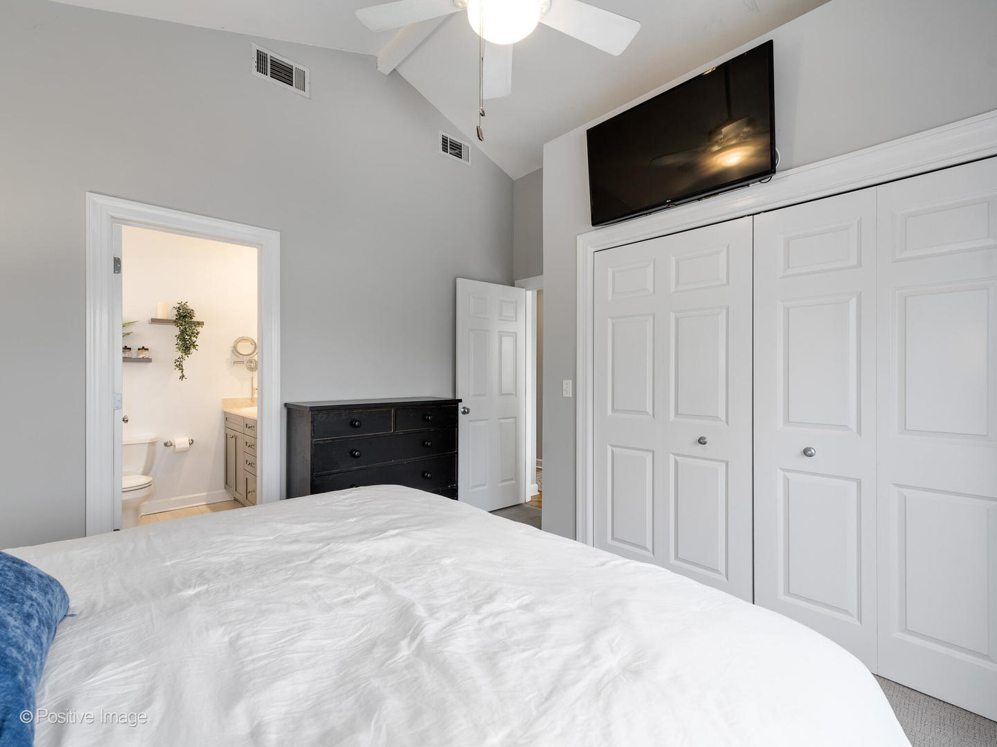 2938 North Damen Avenue, Unit 3 Chicago, IL 60618 - Photo 14 of 22 a bedroom with a bed and a flat screen tv