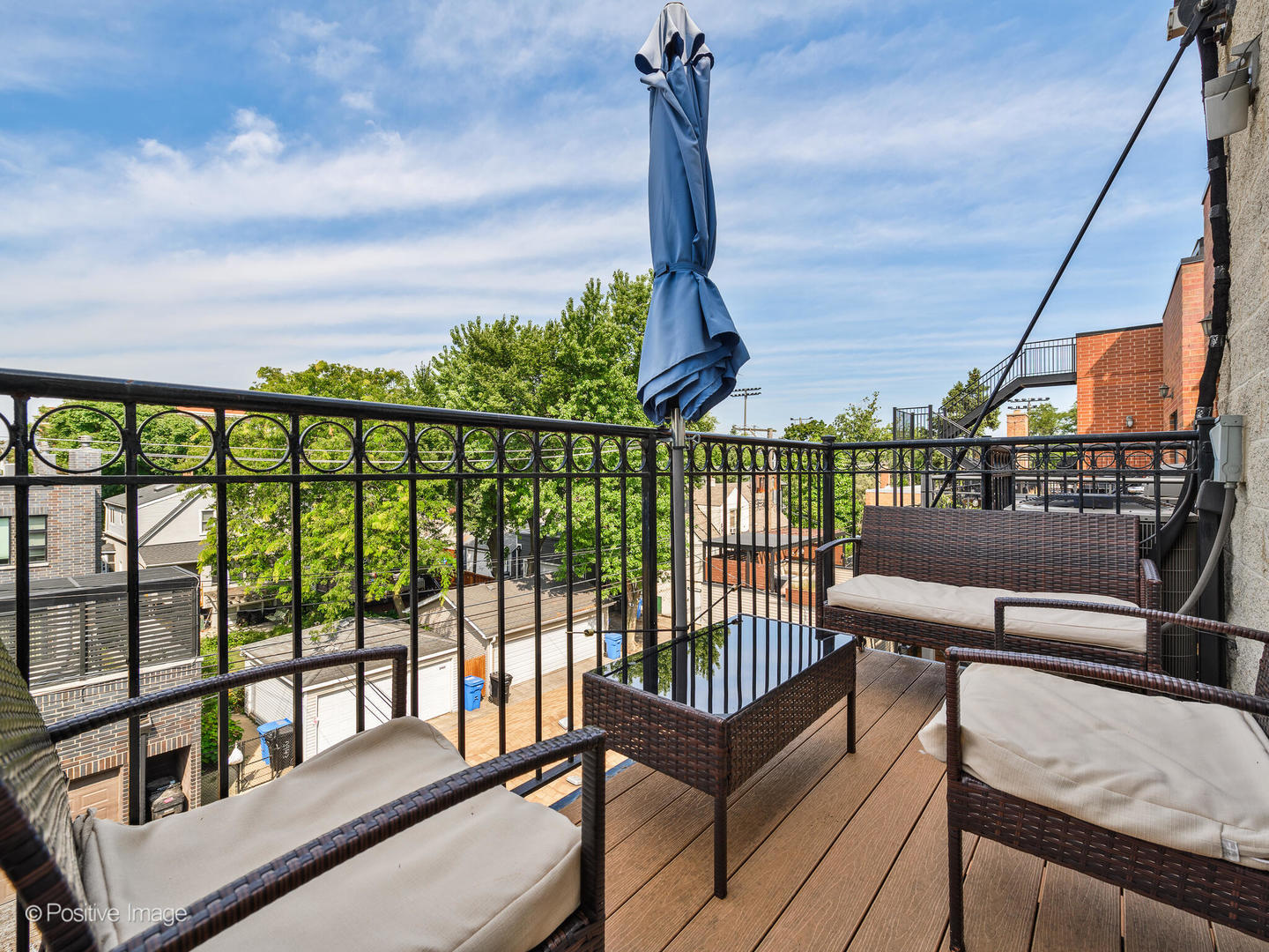 2938 North Damen Avenue, Unit 3 Chicago, IL 60618 - Photo 19 of 22 a view of a balcony with furniture