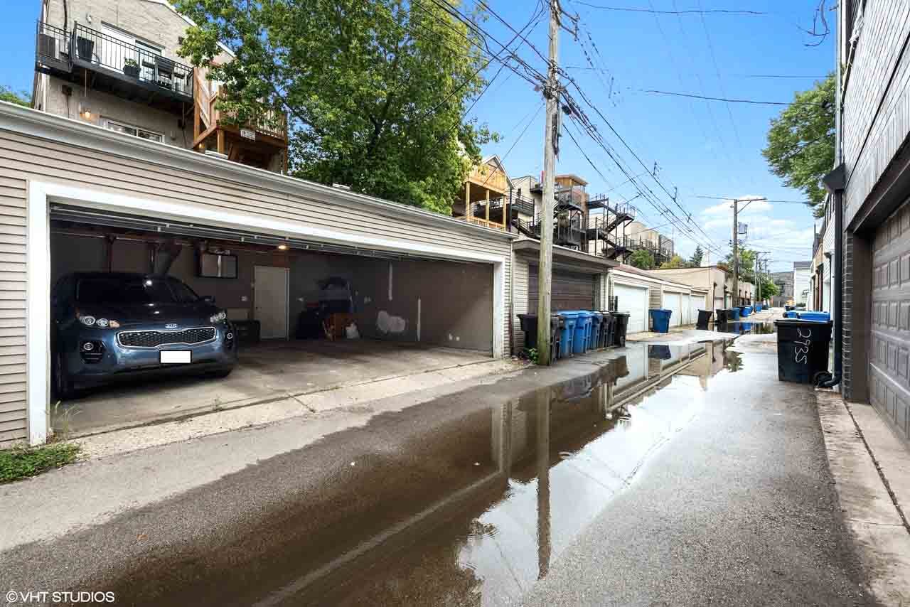 2938 North Damen Avenue, Unit 3 Chicago, IL 60618 - Photo 22 of 22 a view of a car park in front of a building