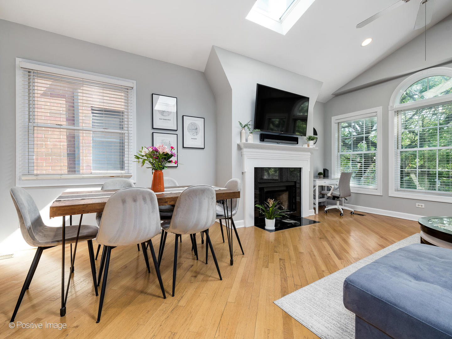 2938 North Damen Avenue, Unit 3 Chicago, IL 60618 - Photo 3 of 22 a living room with furniture fireplace and flat screen tv