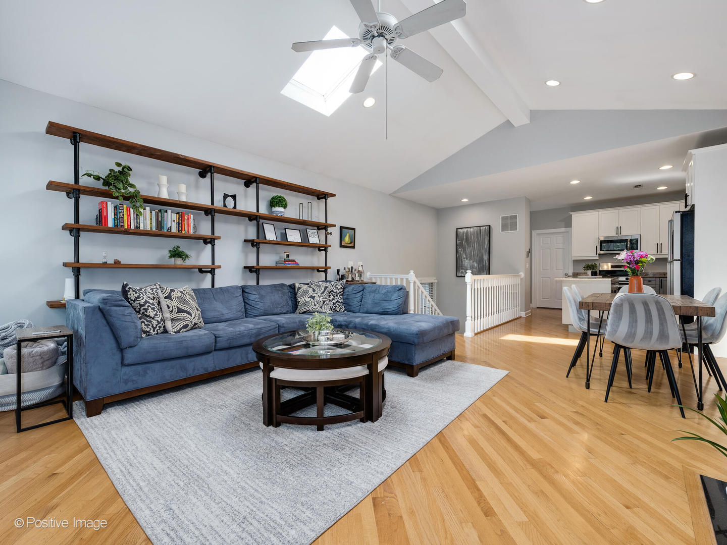 2938 North Damen Avenue, Unit 3 Chicago, IL 60618 - Photo 8 of 22 a living room with furniture a rug and a bookshelf