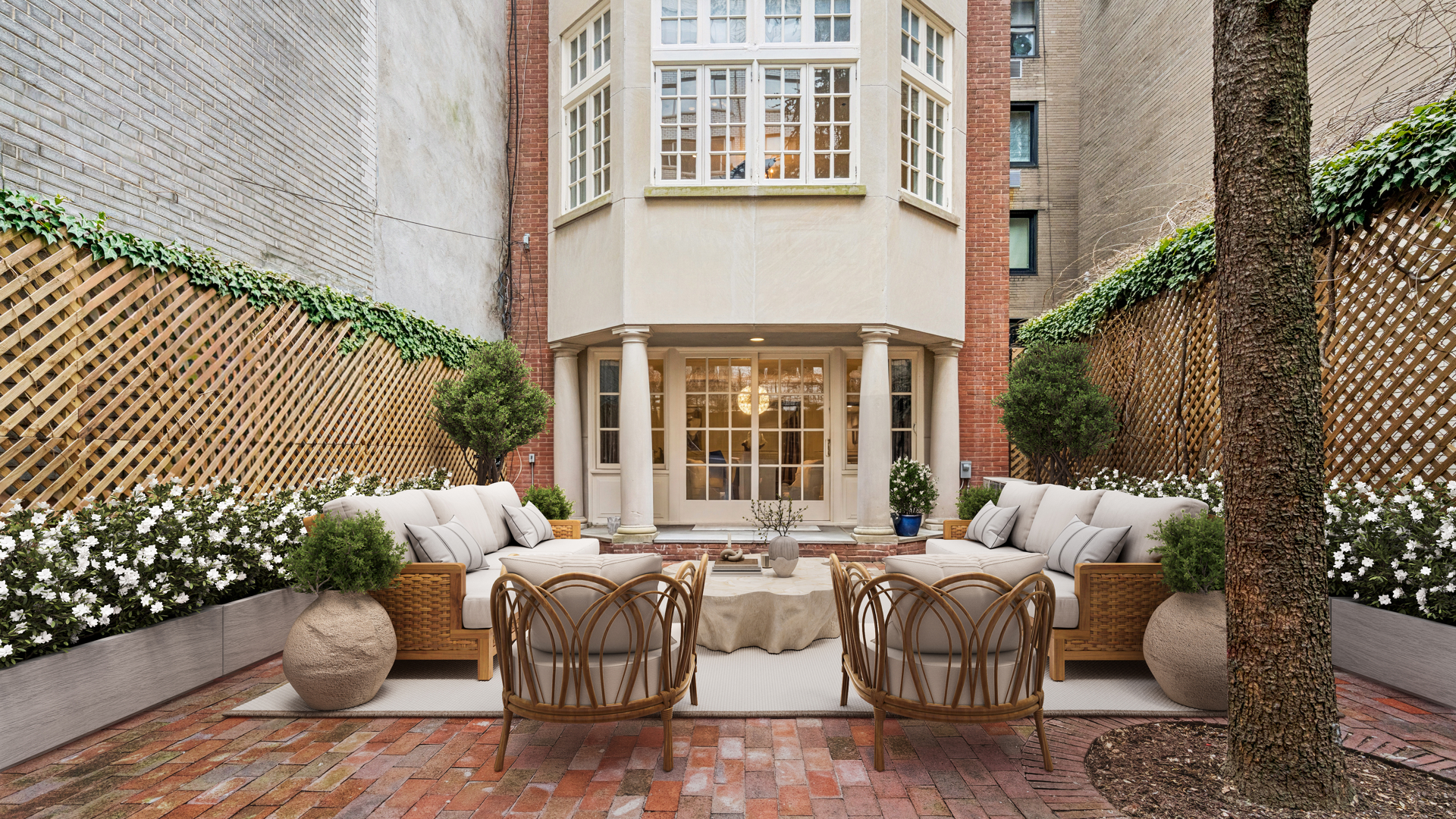 7 East 69th Street Manhattan, NY 10021 - Photo 21 of 27 a view of a patio with couches table and chairs and potted plants