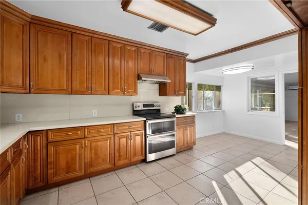 a kitchen with stainless steel appliances granite countertop a sink and cabinets