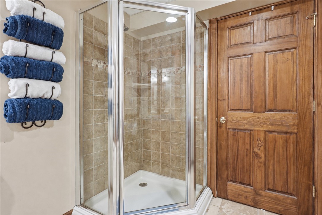 2057 Stirnie Road Victor, NY 14564 - Photo 32 of 48 The finished lower level features its own incredibly spacious full bathroom, completely updated and a bright walk-in shower.