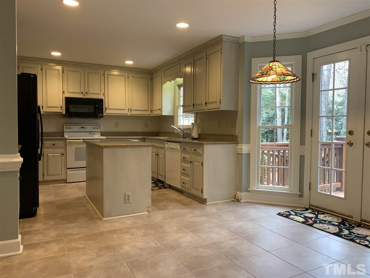 8800 Audley Circle Raleigh, NC 27615 - Photo 11 of 27 a kitchen with stainless steel appliances granite countertop a stove top oven a sink dishwasher and a refrigerator