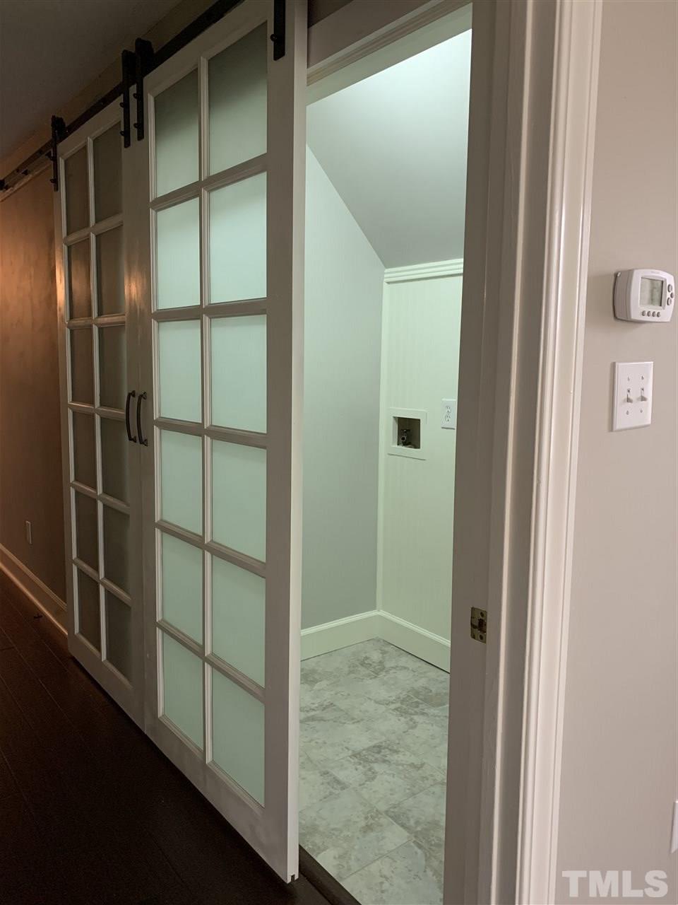 8800 Audley Circle Raleigh, NC 27615 - Photo 16 of 27 a bathroom with a glass shower door