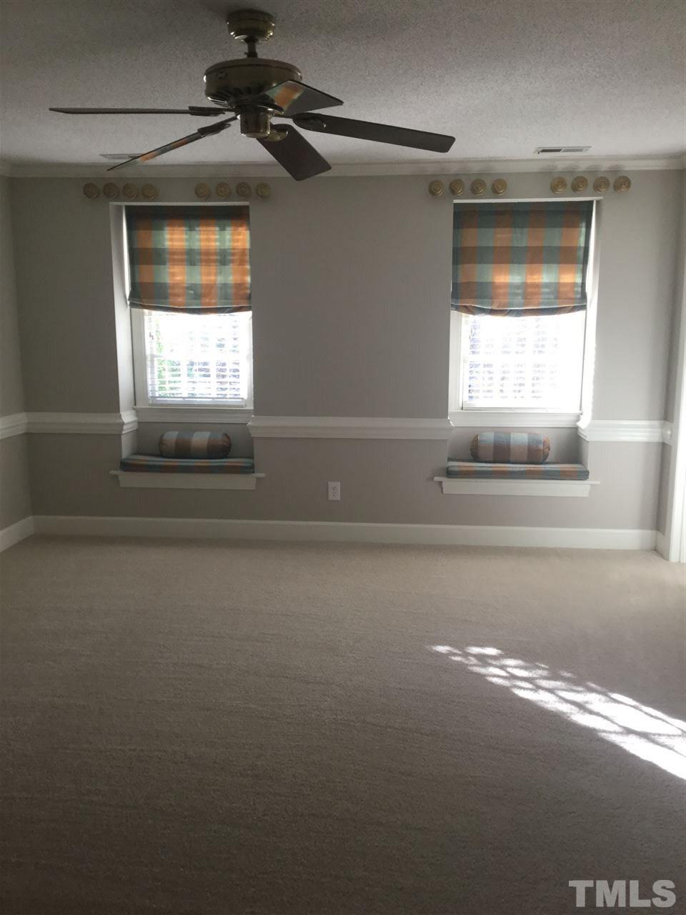 8800 Audley Circle Raleigh, NC 27615 - Photo 18 of 27 a view of empty room with wooden floor and fan