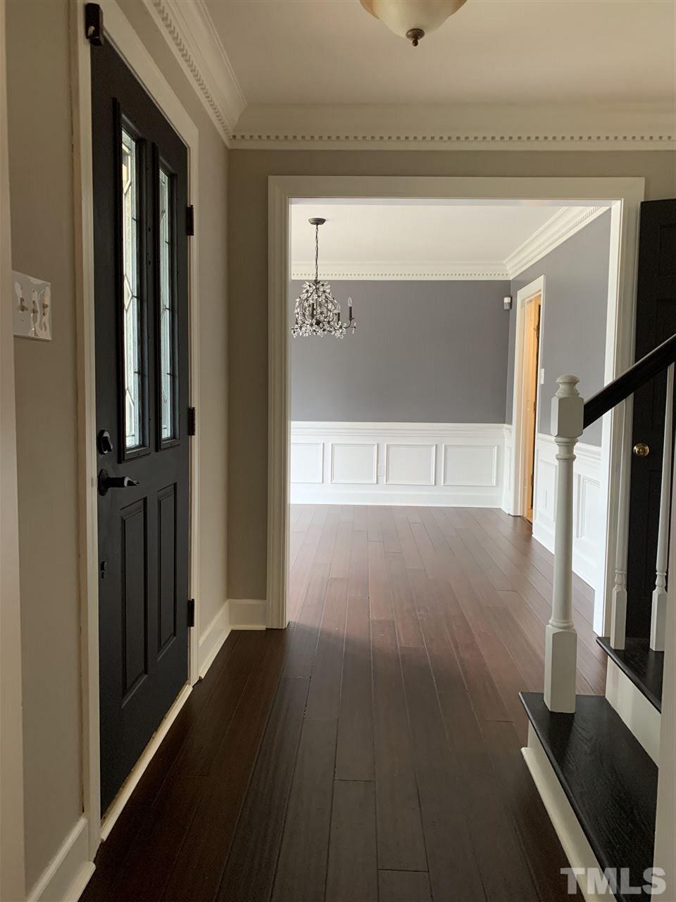 8800 Audley Circle Raleigh, NC 27615 - Photo 3 of 27 a view of a livingroom with wooden floor and a flat screen tv