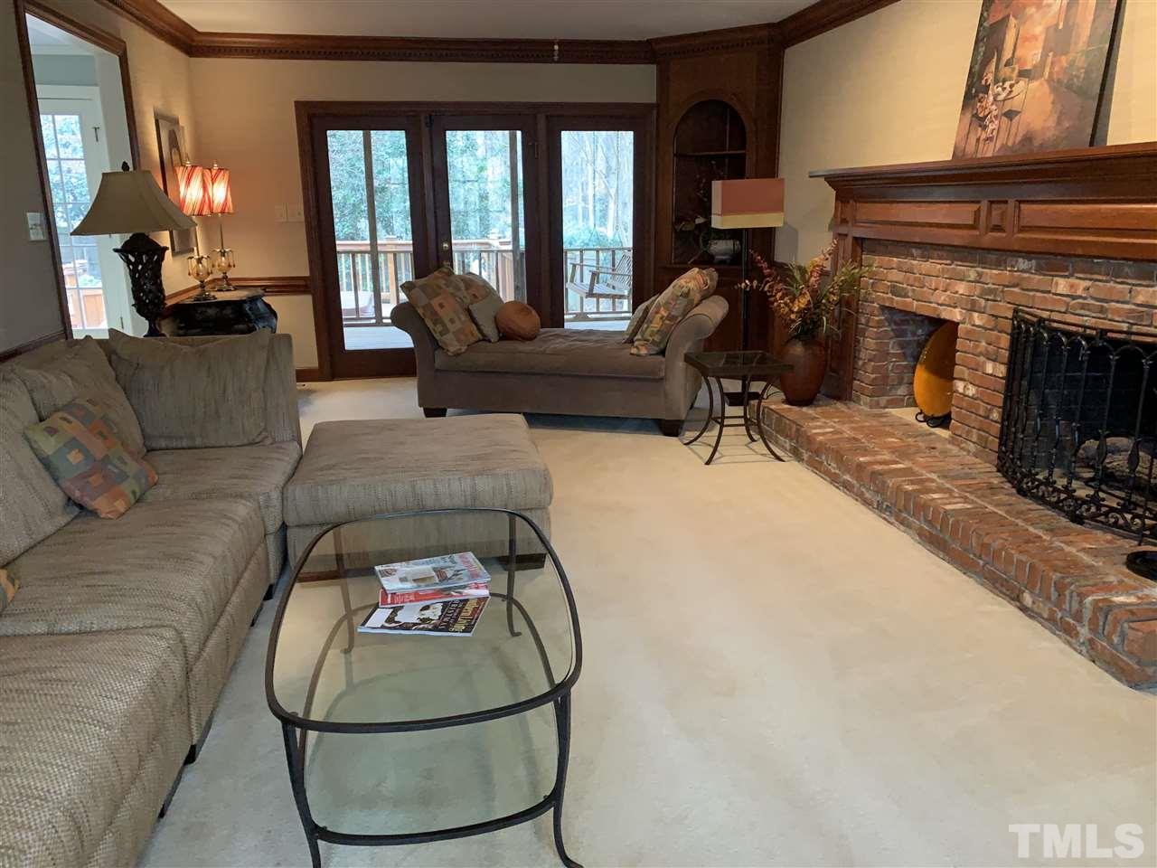 8800 Audley Circle Raleigh, NC 27615 - Photo 5 of 27 a living room with furniture and a fireplace