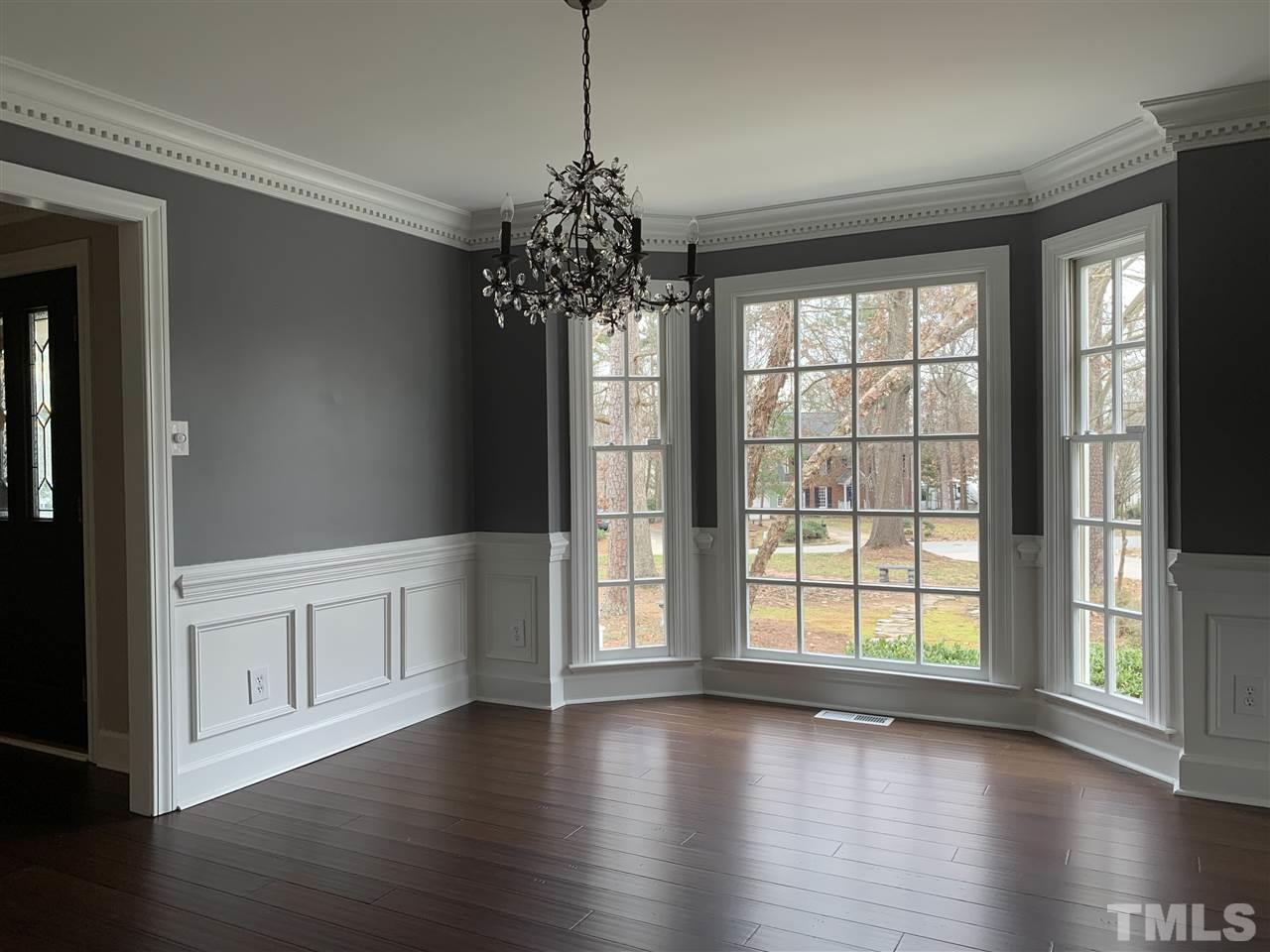 8800 Audley Circle Raleigh, NC 27615 - Photo 8 of 27 a view of an empty room with wooden floor and a window