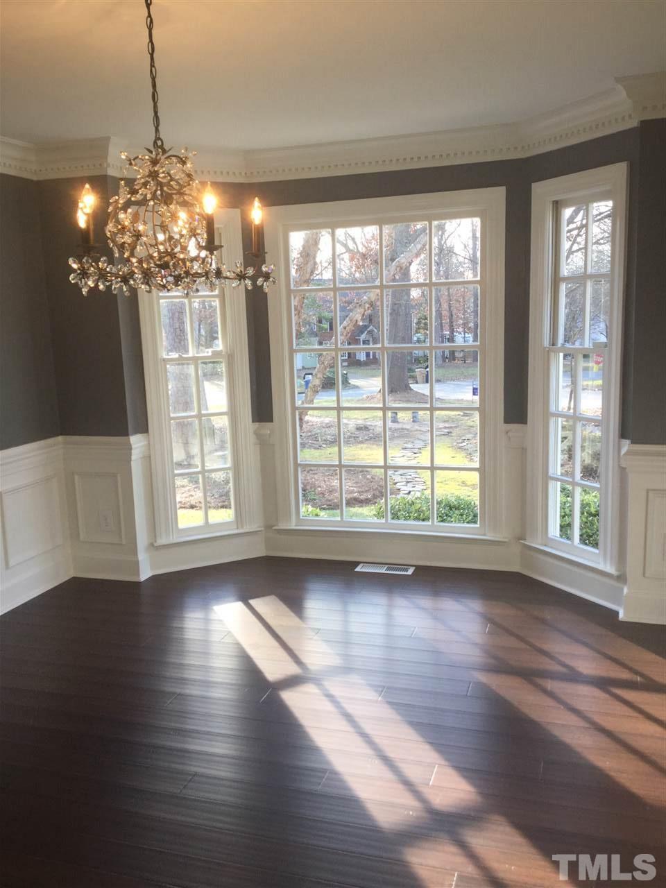 8800 Audley Circle Raleigh, NC 27615 - Photo 10 of 27 a view of a room with wooden floor chandelier and windows