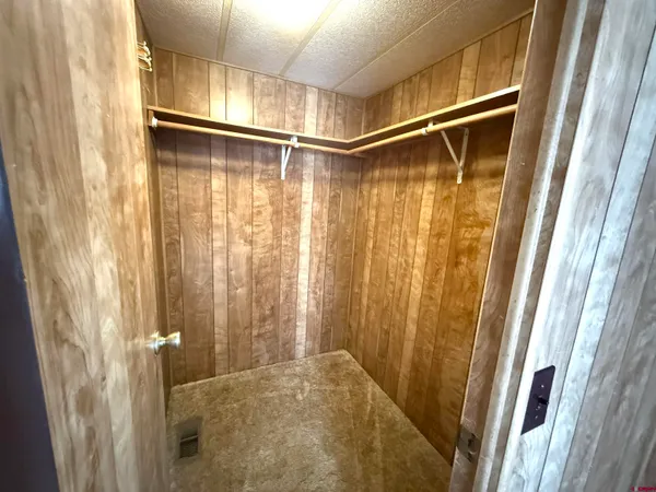 a white toilet sitting next to a shower curtain