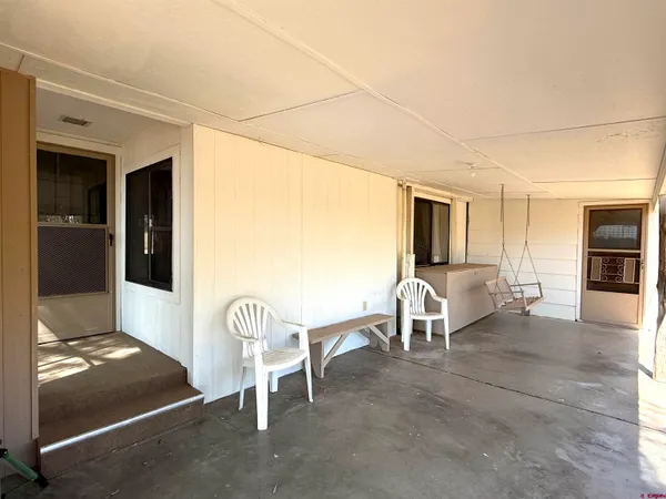 a living room with furniture a dining table and a fireplace
