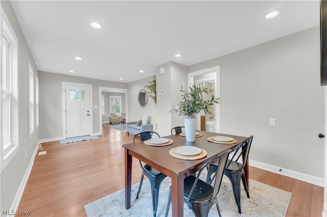18155 Libby Road Maple Heights, OH 44137 - Photo 15 of 32 Spacious dining area featuring wood-finish flooring, recessed lighting, and light gray wall tones