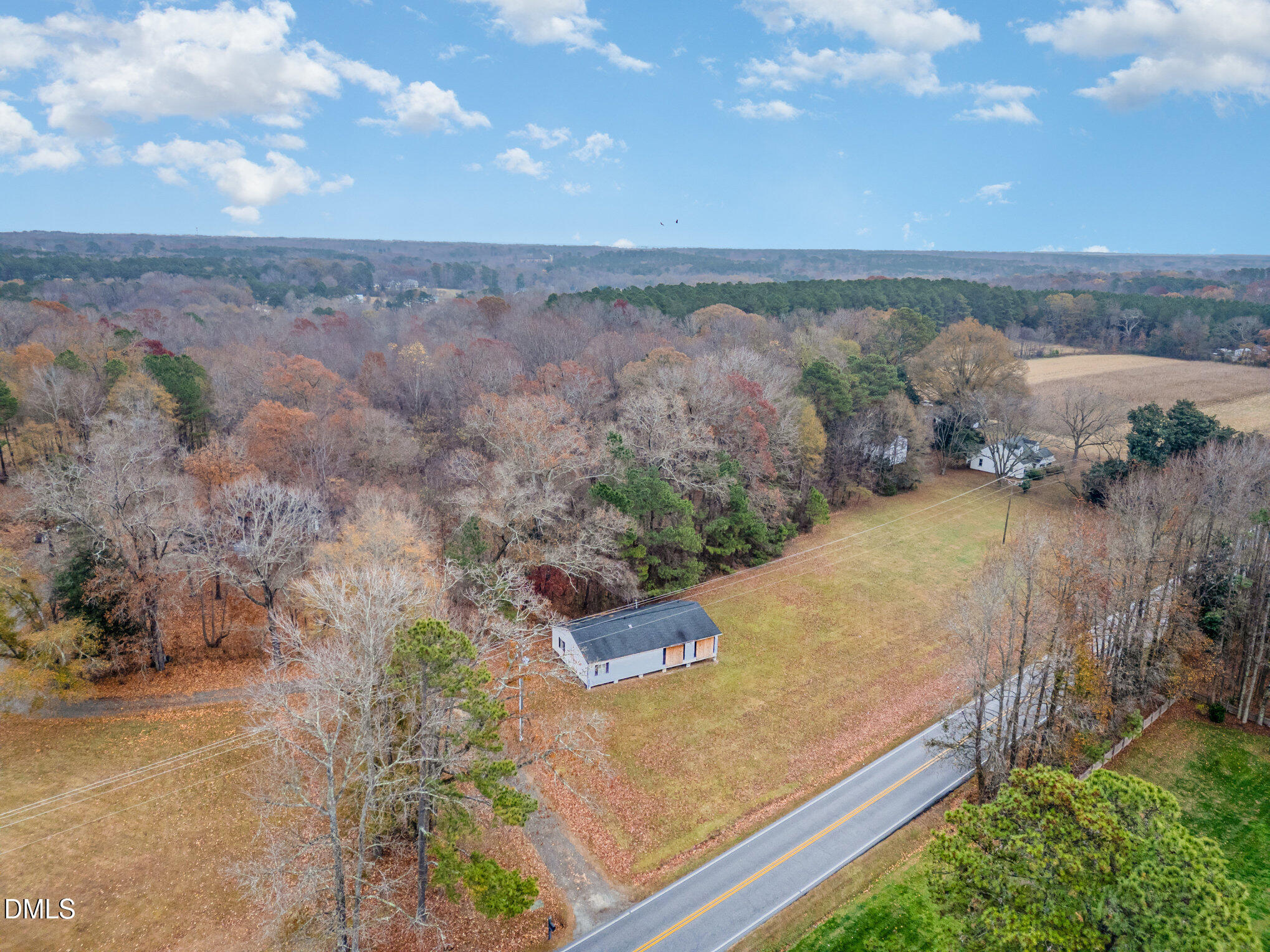 6801 Rock Service Station Road Raleigh, NC 27603 - Photo 7 of 36 an aerial view of residential house and outdoor space