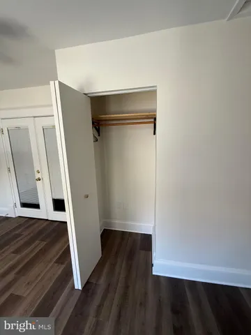 a view of front door with wooden floor