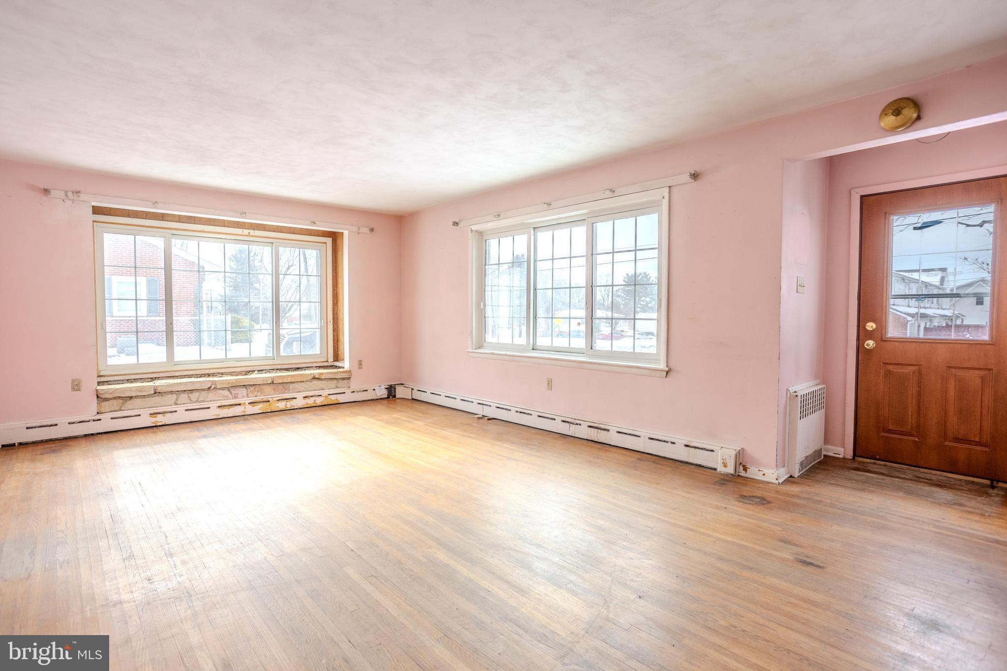 241 Wagner Road Chambersburg, PA 17202 - Photo 11 of 37 an empty room with wooden floor and windows